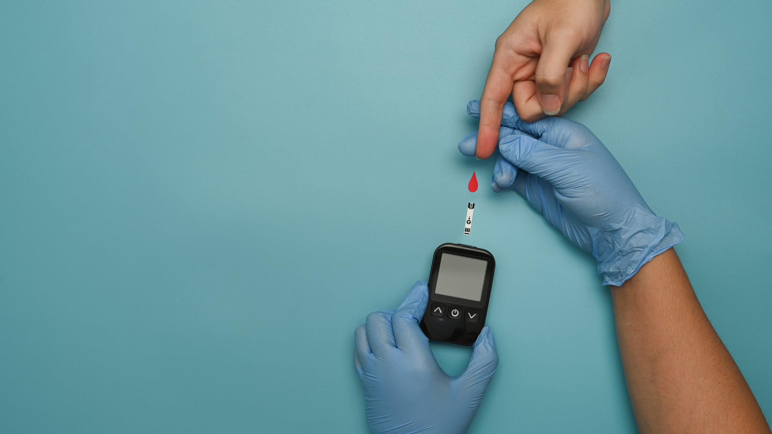 Overhead view of doctor check up blood glucose levels of diabeti